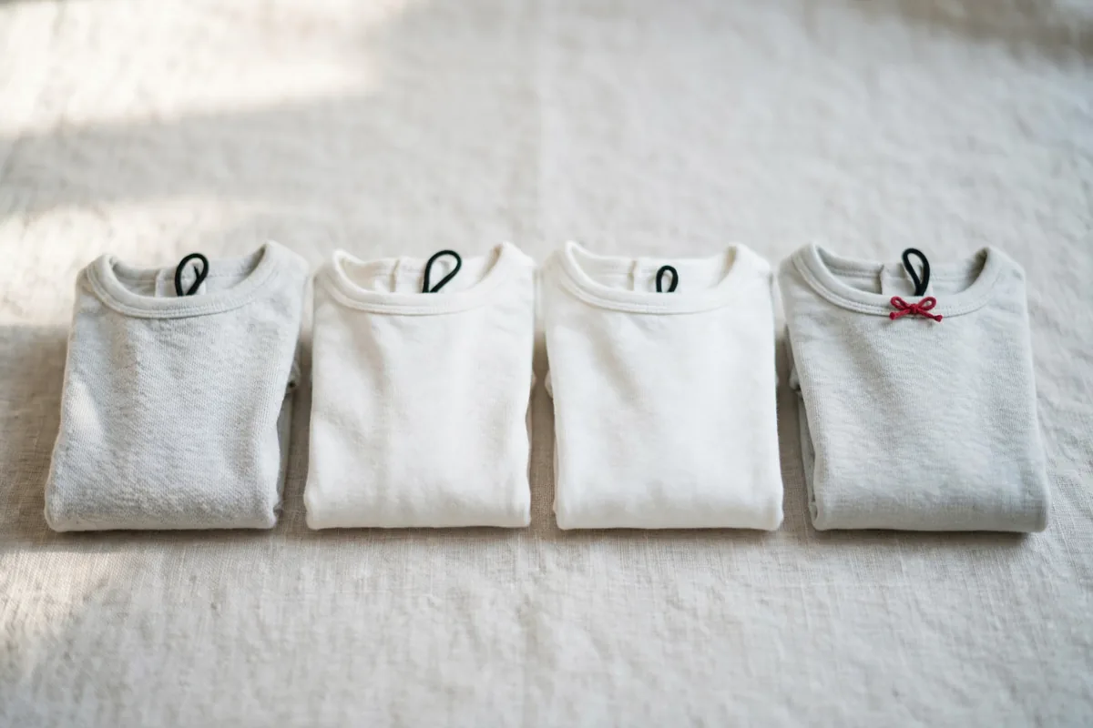 Small plain children's T-shirts folded in a row